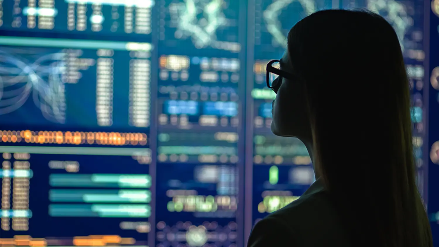businesswoman in glasses standing near the display